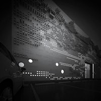 a black and white photo of a building with dots on it