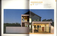 a magazine with a picture of a modern house