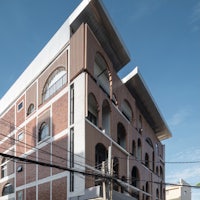 an apartment building on the corner of a street