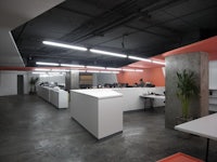 a modern office with orange walls and concrete floors