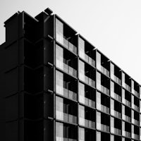 a black and white photo of an apartment building