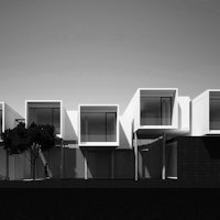 a black and white image of a modern house