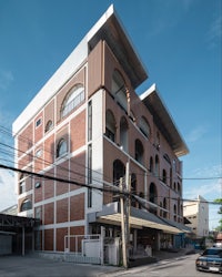 a brick building with a car parked in front of it