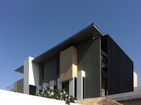 a modern house with a black and white facade