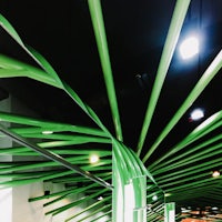 a green ceiling in a shopping mall