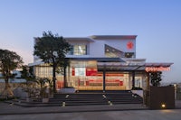 a modern building with a red and white exterior